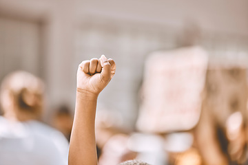 Image showing Protest, equality and fist in air in city, crowd of people in street protesting for human rights, freedom and marching. Black lives matter movement, social justice and raised hand of black person