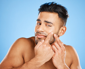 Image showing Skincare, beauty and model check for acne breakout, pimple or facial scar after wellness, self care or healthcare treatment. Dermatology, cosmetology or aesthetic man with spa routine for skin health