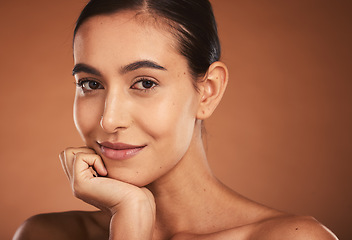 Image showing Makeup, skincare and portrait of a woman with a smile for cosmetics against a brown mockup studio background. Face of a happy, luxury and cosmetic model with wellness, beauty and care for skin