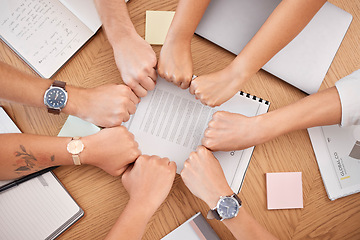 Image showing Team hands, business meeting and fist for collaboration or motivation support at office desk. Diversity, corporate teamwork strategy and professional partnership trust success planning in workplace