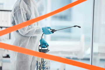 Image showing Warning tape, spray sanitizer in covid hospital and man in job suit for healthcare cleaning to stop bacteria. Cleaner ppe disinfect, covid 19 virus hygiene and health safety risk of corona in clinic