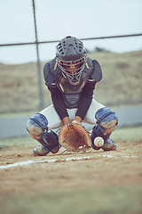 Image showing Baseball, sports and ball with a catcher on a grass pitch or field during a game or match outdoor. Fitness, exercise and catch with a male baseball player playing a competitive sport outside