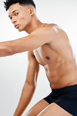 Image showing Fitness, wellness and healthy body of black man in studio with white background for body care. weight loss and diet. Workout, exercise and black man pose in underwear for muscles, strength and abs
