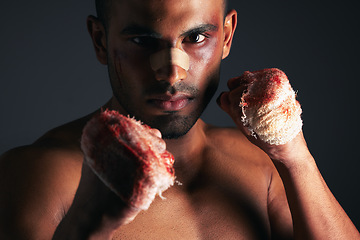 Image showing Man, face and blood fist fight with first aid bandages for fighting injury after boxing match. Angry mma athlete boxer, strong bloody hands and fight stand for sports competition in dark background