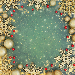 Image showing Christmas Decorative Gold Bauble and Holly Berry Background