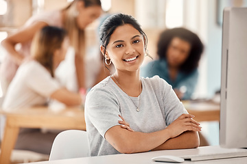 Image showing Computer, learning and education with a woman student sitting at a desk in the classroom for study or development. Portrait, university and scholarship with a young female college pupil in class