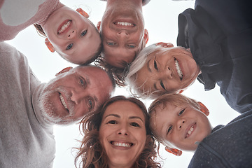 Image showing Family, children and grandparents with a girl, boy and parents standing in a huddle or circle outdoor from below. Kids, love and bonding with a man, woman and grandkids spending time together closeup