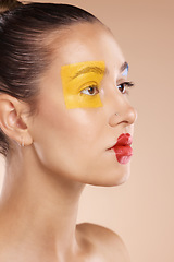 Image showing Beauty, woman and paint on face, makeup or creative art on studio background. Clown, fashion cosmetics or unique self expression, thinking female model from Canada with red lips and yellow eyeshadow.