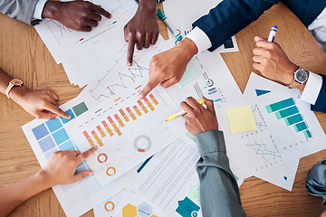 Image showing Meeting, paperwork and business people planning a project together in a corporate modern office. Documents, diversity and hands of a team working on a strategy with statistics, graphs and charts data