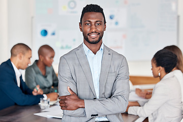 Image showing Leadership, meeting and planning with a black man and his business team in the boardroom for strategy. Portrait, leader and collaboration with a male manager standing arms crossed in his office