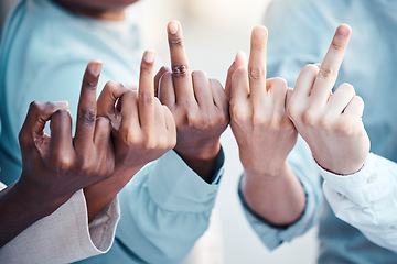 Image showing Business people, hand and middle finger with rude, gesture and conflict with disrespect, conflict and opinion. People, finger and hands show sign, icon and fingers with diversity, vote and bad