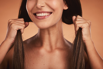 Image showing Strong hair woman, studio closeup smile and cosmetic face beauty against orange background. Hair care health, happy cosmetic girl and healthy brunette happiness for wellness model with natural locks