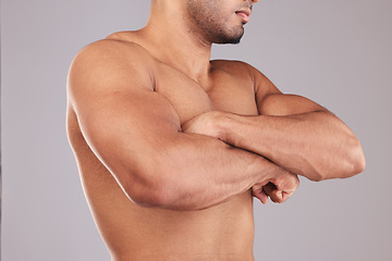 Image showing Strong, flex and man arms with muscle after training while standing in a studio with gray background. Power, motivation and closeup of athlete model with strength from bicep after workout or exercise