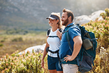 Image showing Travel, hiking and couple trekking in nature for holiday, adventure and summer together in Norway. Happy, smile and man and woman on a mountain walk for an outdoor vacation on a field for happiness