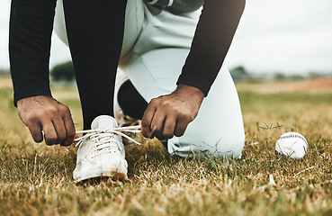 Image showing Baseball, shoes and grass with ball and baseball player, sports and fitness closeup during game on baseball field. Competitive sport outdoor, exercise and workout, professional athlete and active.