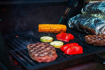 Image showing Pork meat steaks on the grill