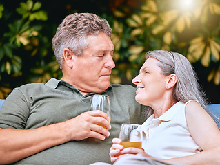 Image showing Love, juice and senior couple talking while relaxing outdoor in the garden at their home in summer. Happy, conversation and elderly man and woman in retirement resting together at their house.