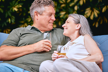Image showing Senior couple, drink and relax while on retirement, love and happy together on vacation and outdoor. Elderly, man and woman enjoy retirement, romantic and care in relationship with relaxing lifestyle