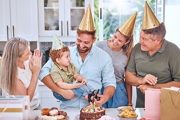 Image showing Happy family, cake and happy birthday for a child at a party with a big family in a lovely celebration at home. Excited grandparents, mother and father celebrate a young kids birthday party together