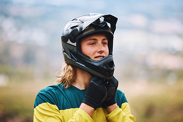 Image showing Motor cross, motorcycle sports and man biker ready for a bicycle race or training outdoor in nature. Motorbike helmet, guy and adventure sport person outdoors for fitness, workout and cycling