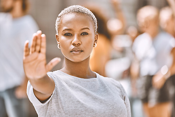 Image showing Stop, protest and hand of black woman in city for activism, social justice or empowerment. Justice, freedom and support with girl no or caution sign for global change, human rights or gender equality