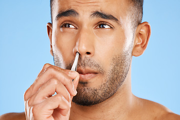 Image showing Man, nose grooming and facial care beauty wellness treatment blue background in studio. Portrait of young male face, cosmetic body skincare healthy lifestyle and hand nasal hygiene personal care