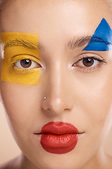 Image showing Beauty, art and portrait of woman paint on face, creative makeup and self expression. Skincare, creativity and color block shape cosmetics, empowerment and freedom to express for young beautiful girl