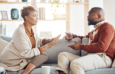 Image showing Marriage problem, argument and couple on sofa angry and talking about finance, home mortgage loan or a serious decision. Communication, family law and talking of black people with divorce discussion