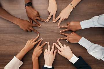 Image showing Team, hands or peace star sign with diversity teamwork, collaboration or team building on desk in office. Business people, support or business meeting for success partnership, community goal or trust