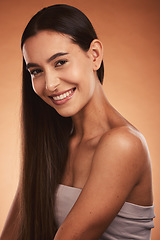 Image showing Beauty, skincare and portrait of a woman with a smile in a studio with a natural face routine. Happy, cosmetics and young model from Brazil with facial or skin treatment isolated by orange background