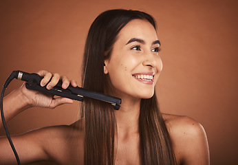 Image showing Flat iron woman, hair care studio and beauty cosmetics with smile against brown background. Hair health happiness, hairdresser cosmetic girl and happy hairstyle for wellness self care, tech and heat