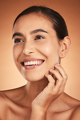 Image showing Skincare, makeup and woman thinking of cosmetics for face against a brown studio background. Spa, wellness and girl model with an idea for cosmetic, care for skin and facial beauty with a smile
