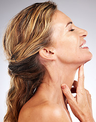 Image showing Skincare, beauty and profile of senior woman isolated in studio on gray background. Happiness, healthy skin and wellness model for skincare products, dermatology care and anti aging beauty products