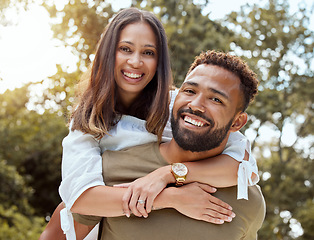 Image showing Love, black couple and with smile hug, bonding and happy together outdoor for fun, loving and embrace. Portrait, romance and man piggy back woman with happiness, marriage, relationship and celebrate.