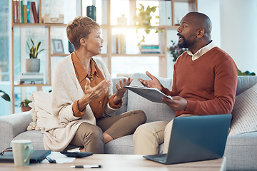 Image showing Mature couple stress, finance and angry talking about budget, home loan and home tax with a list of expenses and a laptop. Black man and woman worried about bad financial debt and mortgage payment