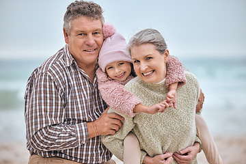 Image showing Grandparents, child and happy family on vacation beach with smile, happiness and support on adventure, travel and time together. Portrait of senior man, woman and girl having fun with piggy back ride