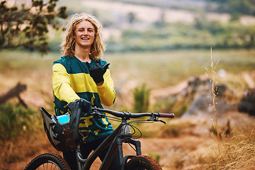 Image showing Sports, bike and cyclist man hand sign in nature on a park trail with a smile. Portrait of an adventure athlete on a bicycle ready for cycling, sport and fitness in a mountain park road in nature