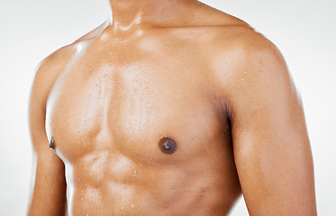 Image showing Fitness, man and chest in studio closeup for health, wellness and muscle against a white background with mockup. Stomach, skincare and guy model torso for six pack, beauty and grooming with mock up