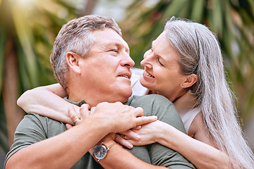 Image showing Senior couple, travel and hug in nature for love, support and care outdoor on retirement vacation for health and wellness. Elderly man and women happy about commitment, marriage and quality time