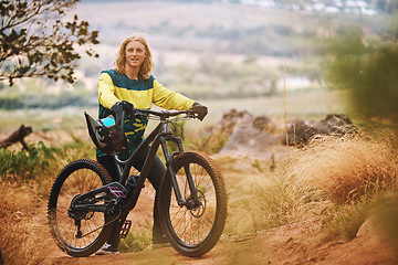 Image showing Cycling, sports and bike rider man on an outdoor, nature and mountain trail ready for a race. Portrait of a person with a bicycle outdoors for training, fitness and cyclist workout on a dirt trail