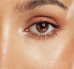 Image showing Beauty, mascara and closeup of an eye with cosmetics, natural makeup and neutral eyeshadow. Vision, lashes and macro zoom of a woman with a brown iris with face or skin cosmetic products.