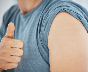 Image showing Vaccine, thumbs up or show shoulder for covid safety, immunization or prevention for illness. Closeup, vaccination or hand gesture for positive reaction, injection against corona or ready for booster