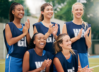 Image showing Netball, sports and women team applause, cheers and celebrate game, competition or training outdoor field support, motivation and teamwork. Happy athlete girl group clapping hands for winner goal