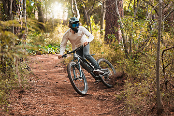 Image showing Man cycling, forest and fitness sport for healthy lifestyle training. Cyclist cardio exercise workout, fast mountain bicycle and freedom adventure outdoors in nature with safety helmet and visor