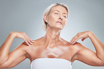 Image showing Skincare, skin and senior woman in studio for beauty, grooming and wellness against a grey background. Relax, body and elderly model posing with shine, glow and healthy skin after anti aging product