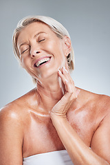 Image showing Happy, senior woman and skincare in studio for cleaning, grooming and wellness on a grey background mockup. Skin, relax and elderly model laugh, enjoy and relax with wrinkles, beauty and treatment