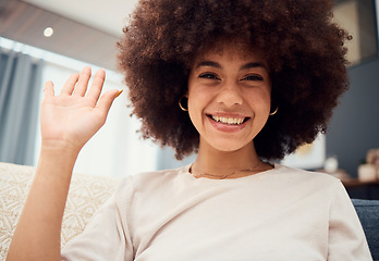 Image showing Smile on face, wave and video call, black woman with afro, happy and sitting on sofa in living room. Relax at home, chat online and connect woman on internet networking and communication on videocall