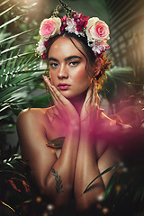 Image showing Crown, flower and portrait of woman in studio for skincare, beauty and product from nature, wellness and makeup. Jungle, rose and face of girl model with leaf, plant and creative forest aesthetic