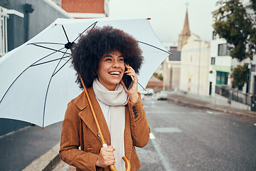 Image showing Phone call communication, rain and girl with umbrella talking, discussion or speaking about London city weather. Mobile conversation, winter storm or happy black woman on 5g network call with contact