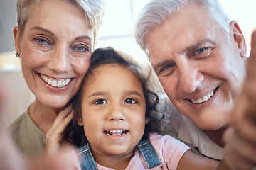 Image showing Interracial family, selfie and girl with grandparents at home feeling happy with love and care. Portrait of senior people with an adopted kid bonding together at a house busy with youth care